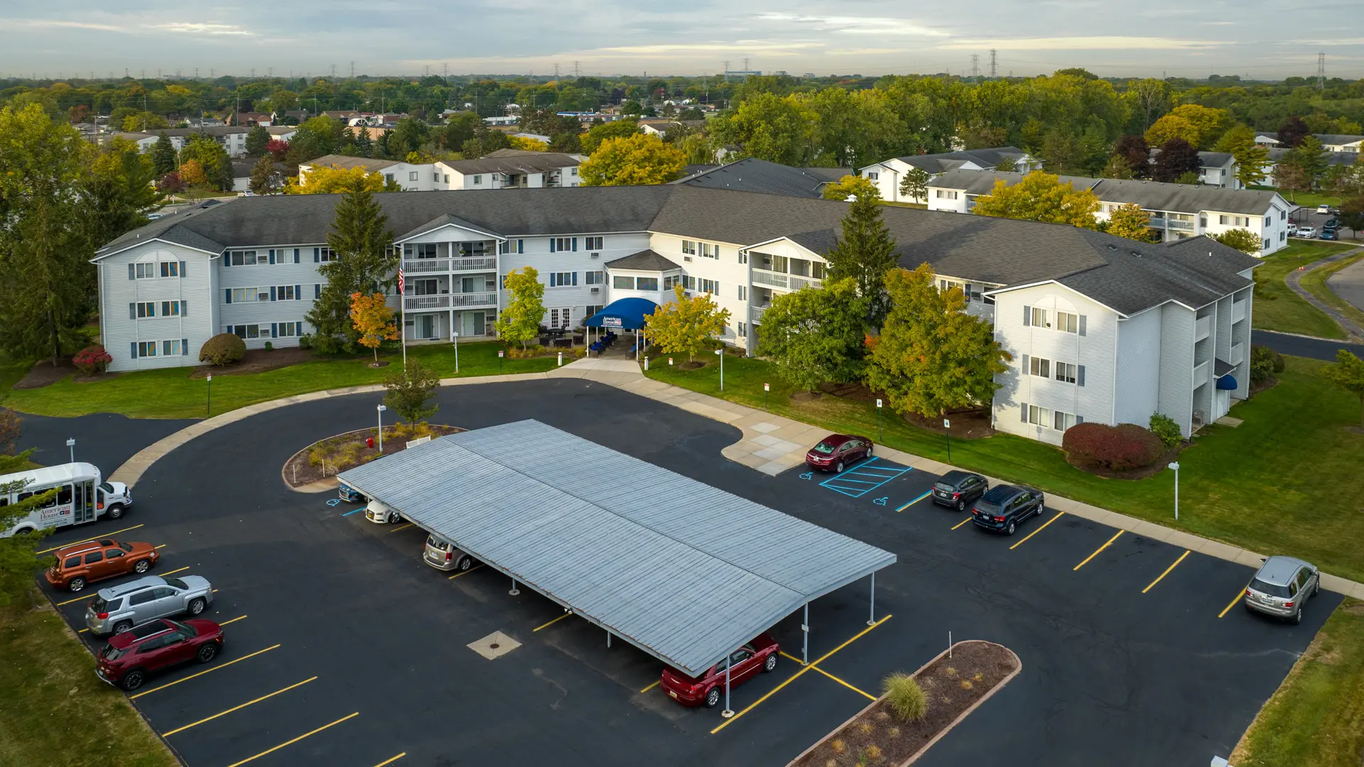 Aerial view of American House Sterling Meadows exterior and parking.
