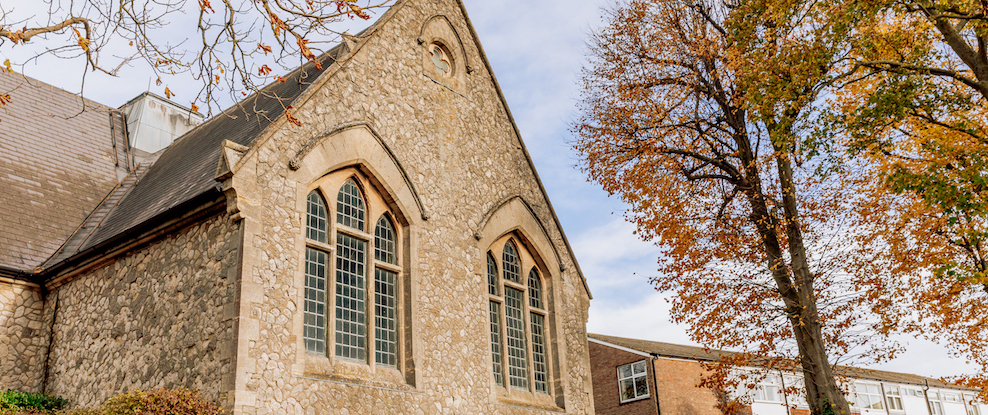 Historic building exterior with autumn trees