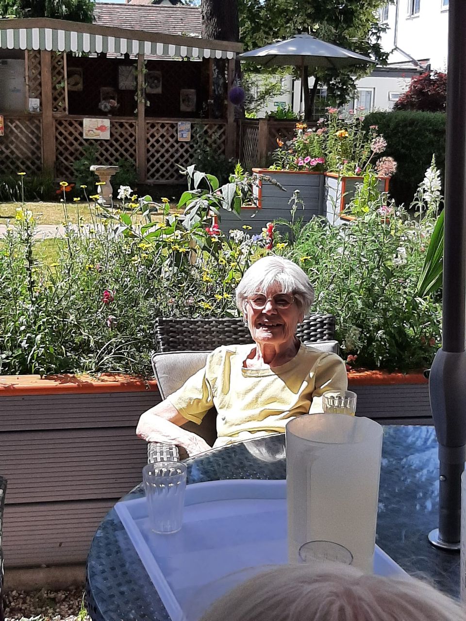 Senior resident enjoying the garden space
