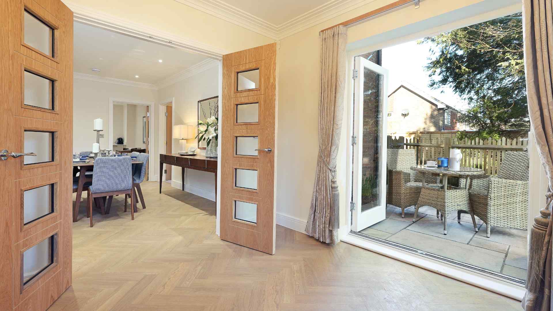 Welcoming common area with open doors and patio