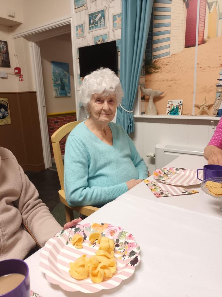 Resident enjoying snacks in a common area.