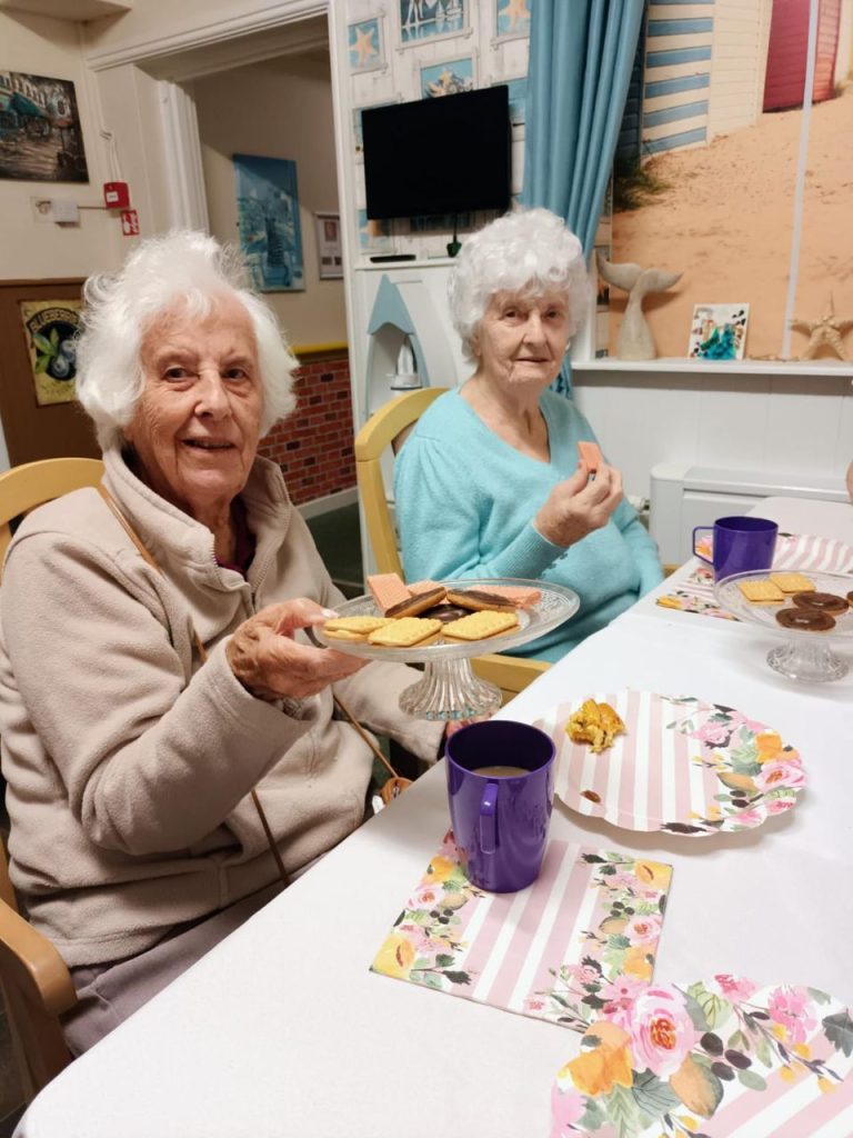 Two senior women enjoying snacks together