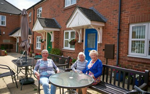 Residents enjoying time outside in a communal area.