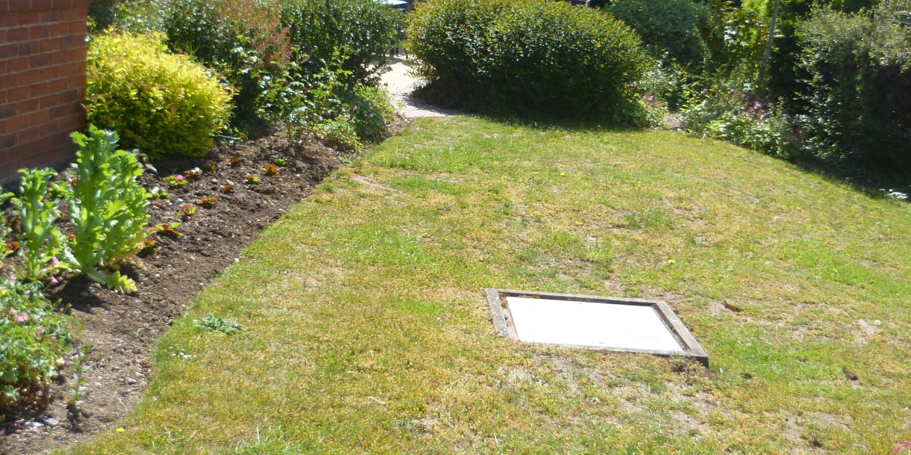 Well-maintained garden area outside a building