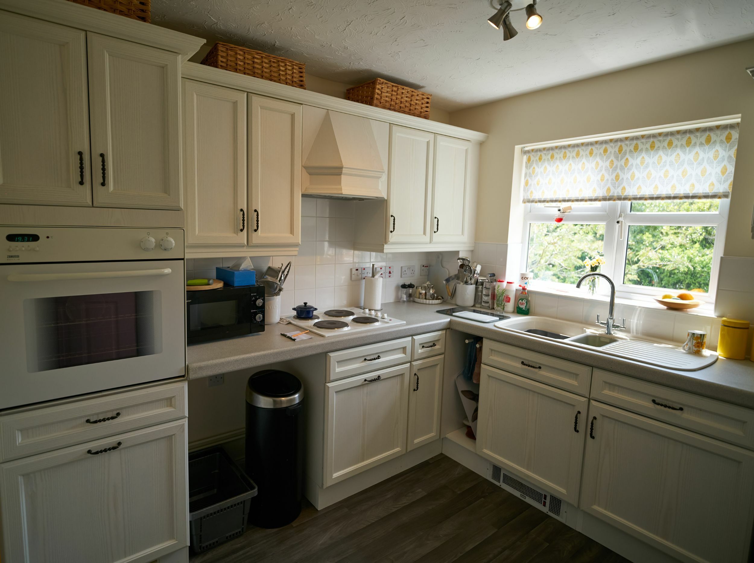 Bright kitchen with modern appliances and natural light.