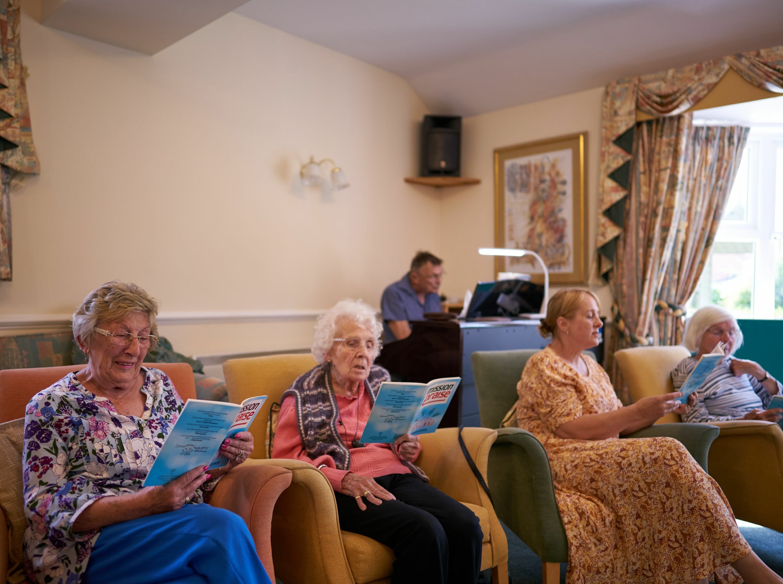 Residents reading in a common area