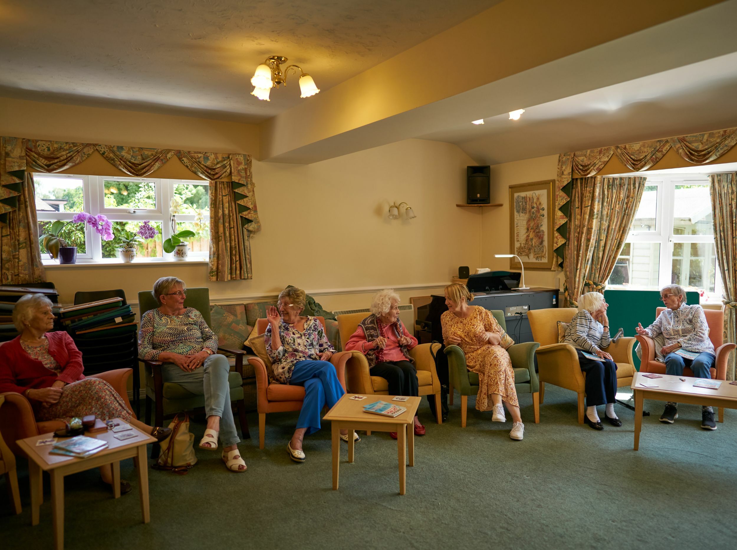 Residents engaging in conversation in a common area.