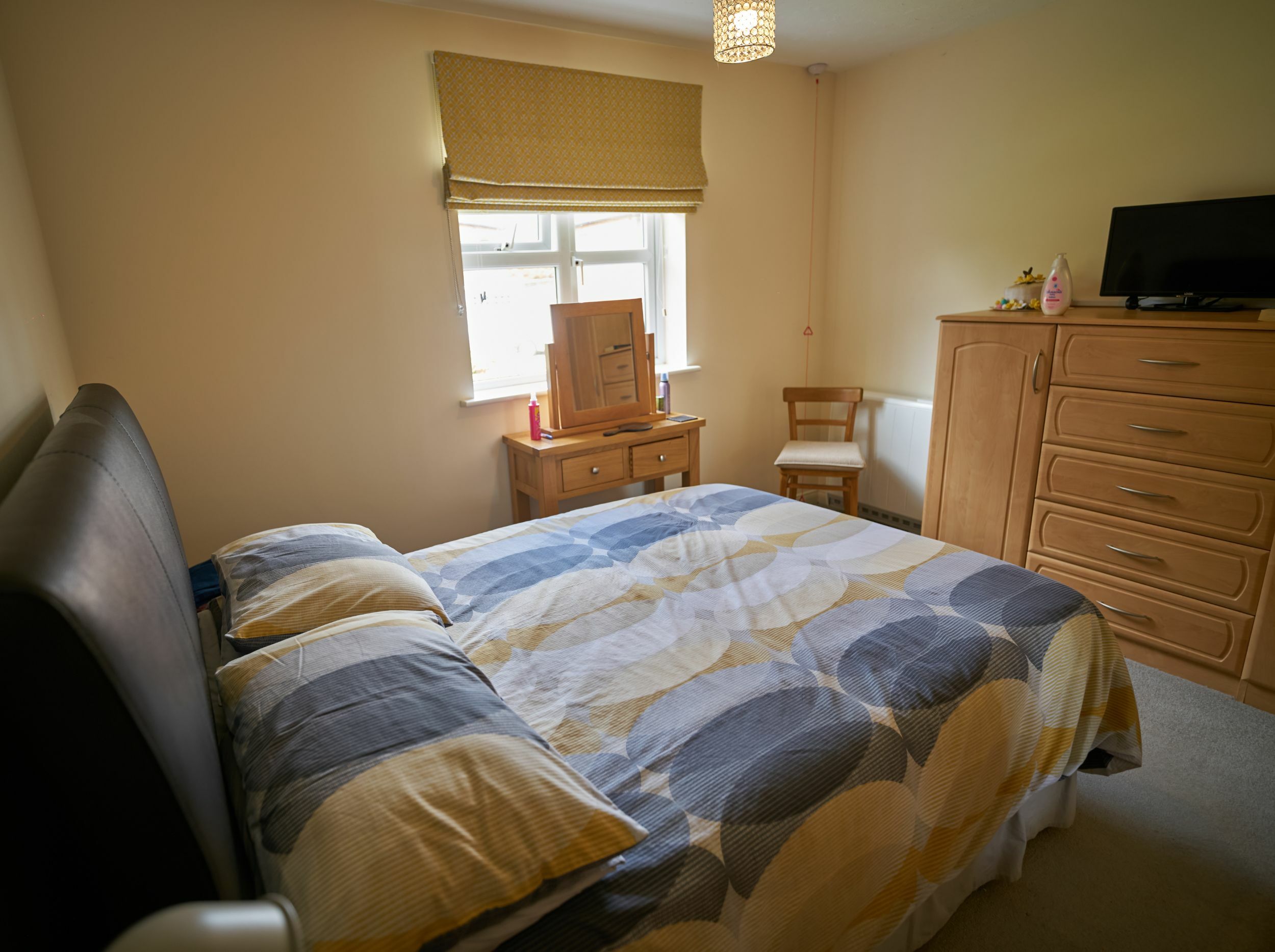 Cozy private bedroom with a double bed and furniture.