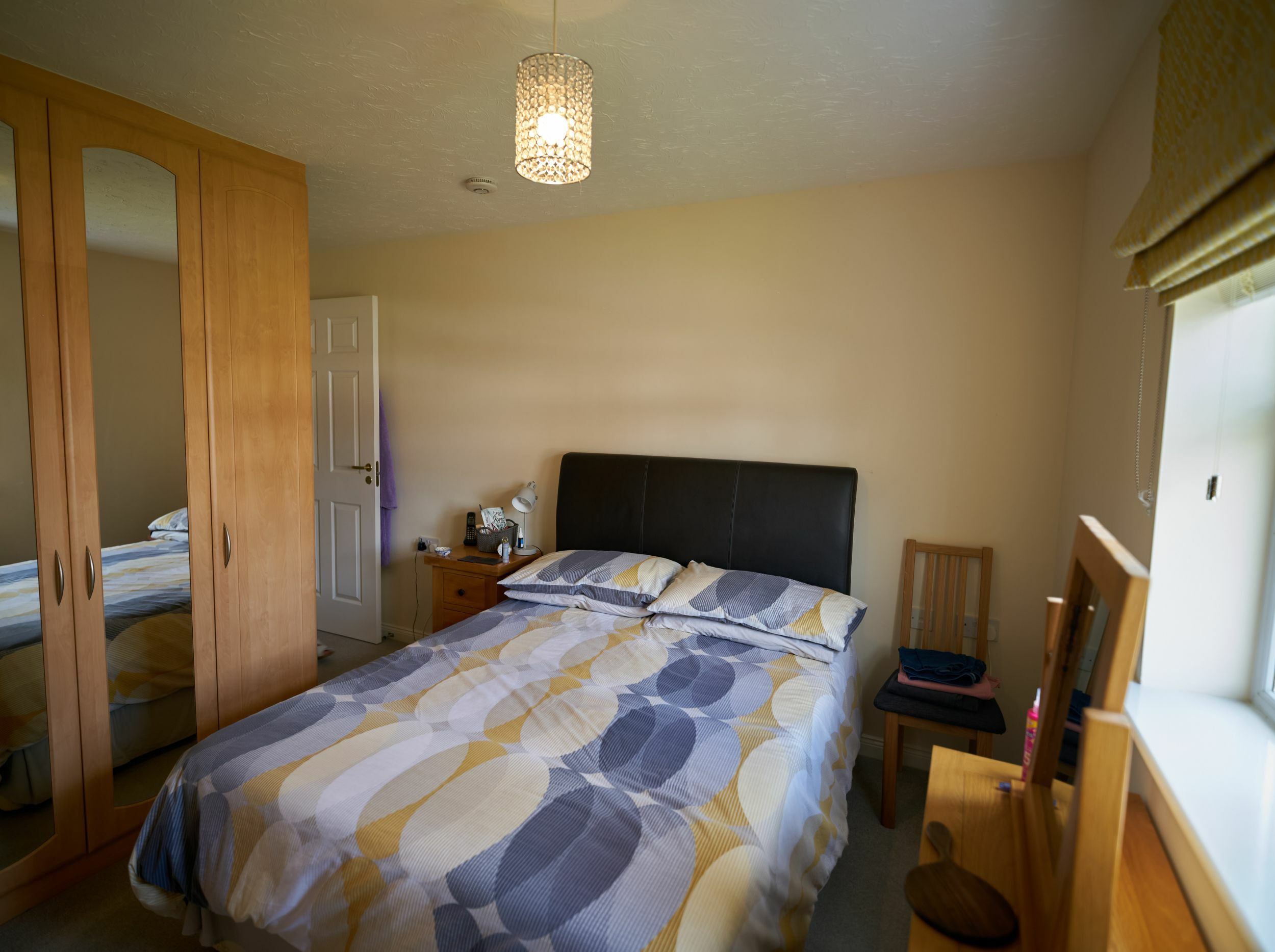 Cozy bedroom with a double bed and furniture