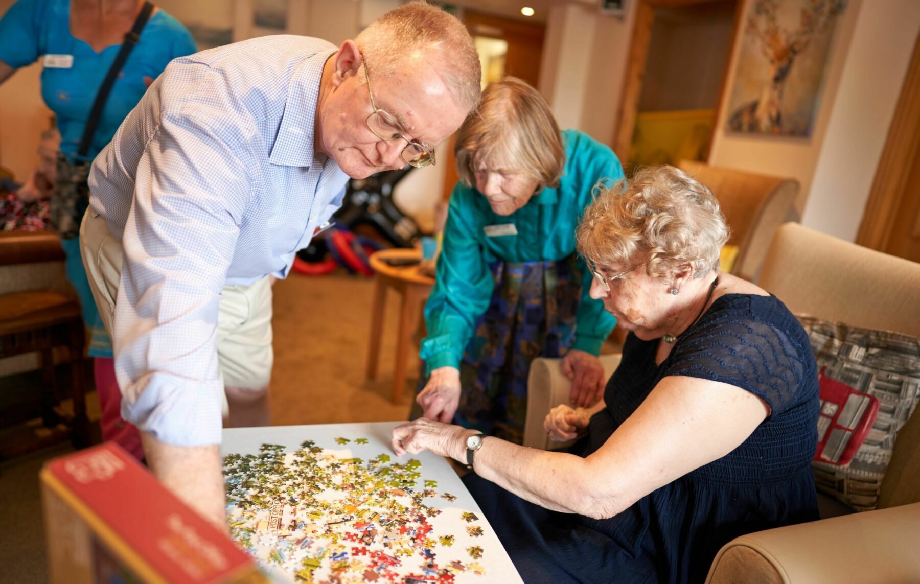 Residents engaging in a puzzle activity together.