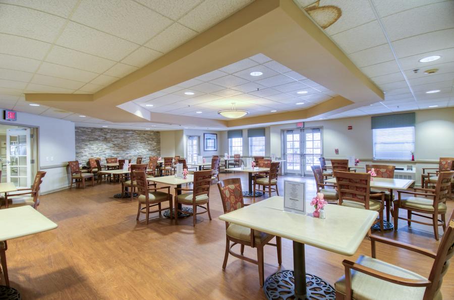 Bright dining room with tables set for meals