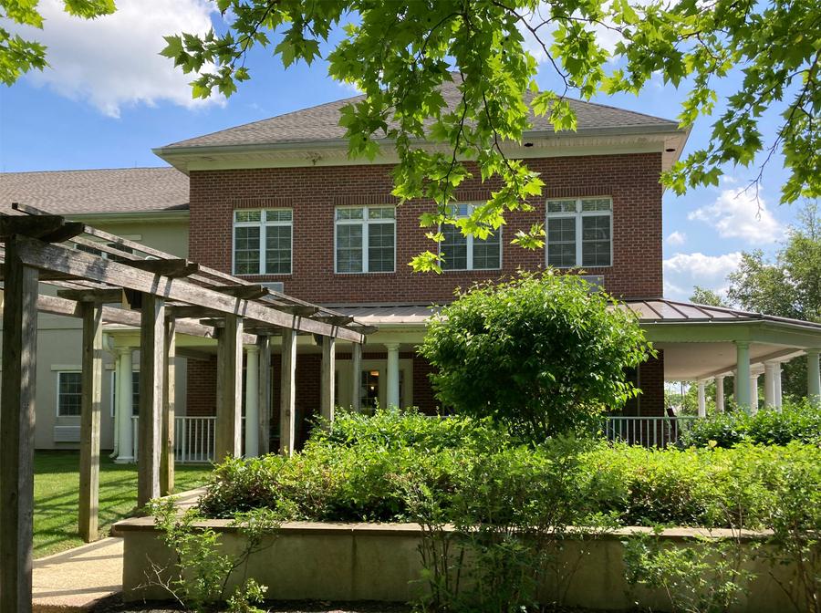 Exterior view of Rose Hill Assisted Living building and garden