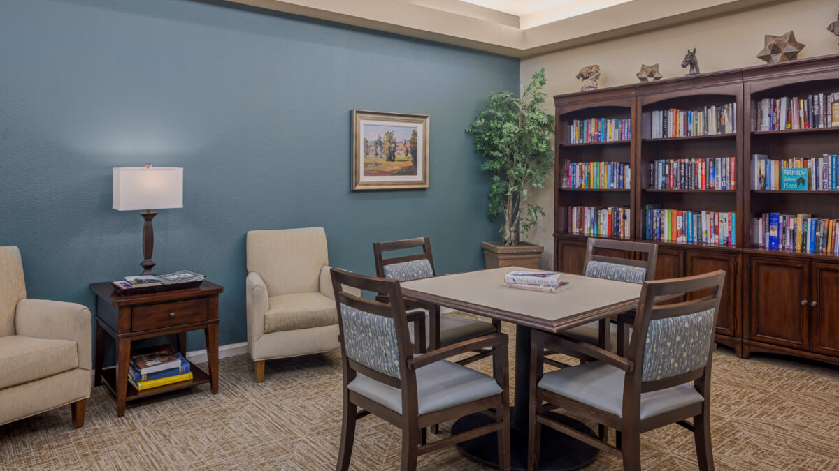 Cozy common area with seating and bookshelves