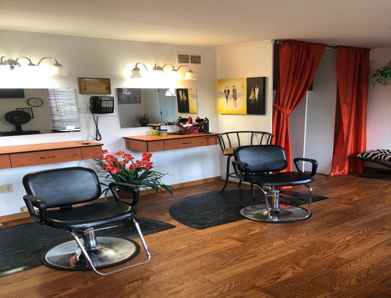 Hair salon area with styling chairs and decor