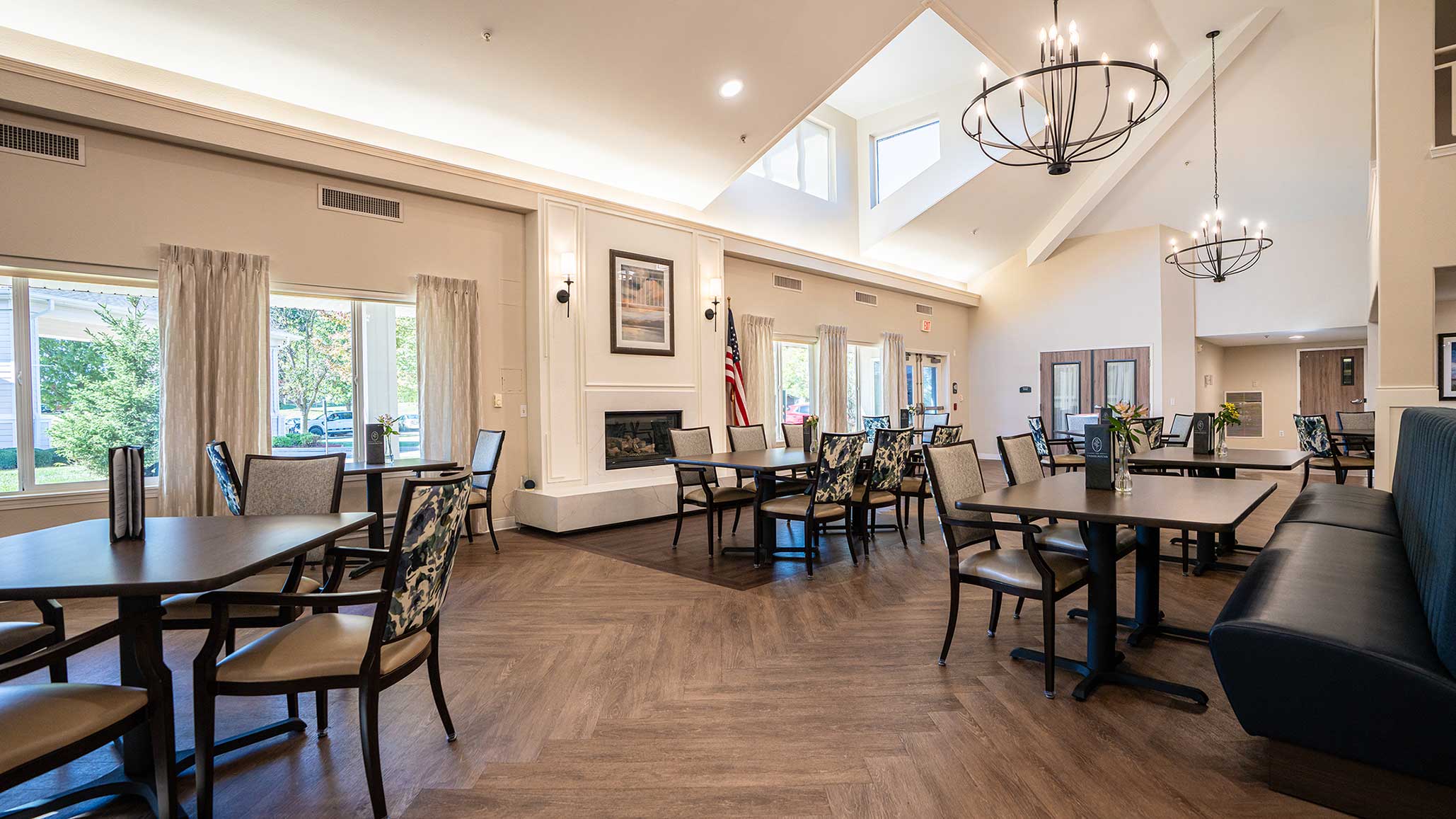 Bright dining room with seating and large windows