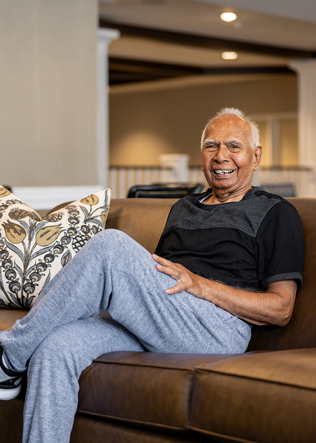 Resident sitting comfortably in a common area