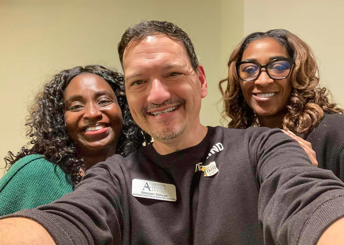Staff members posing together in a friendly atmosphere