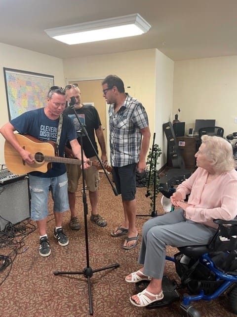 Residents enjoying a live music performance
