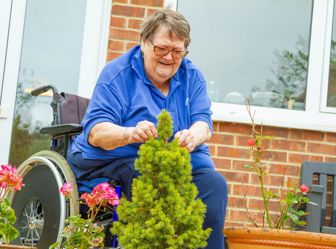 Resident gardening on the patio