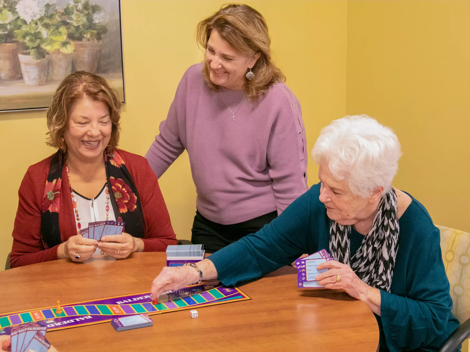 Residents enjoying a game together in a cozy setting
