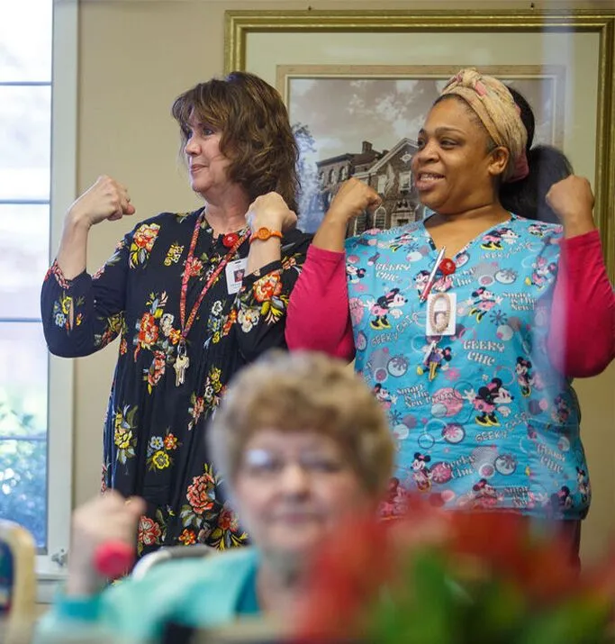 Staff and resident engaged in a fun, active moment