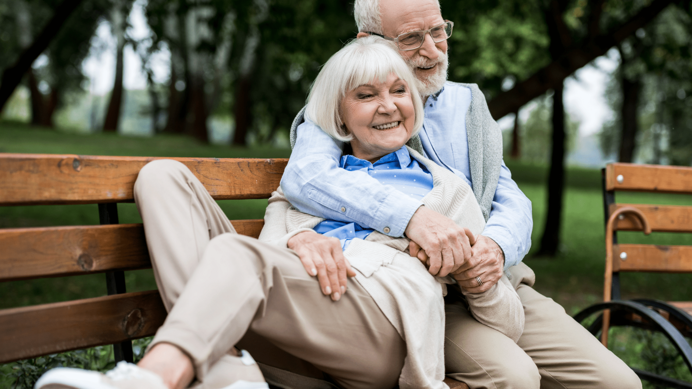Elderly couple enjoying time together on a park bench