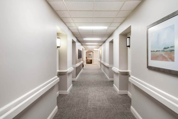Well-lit hallway with artwork and clean design