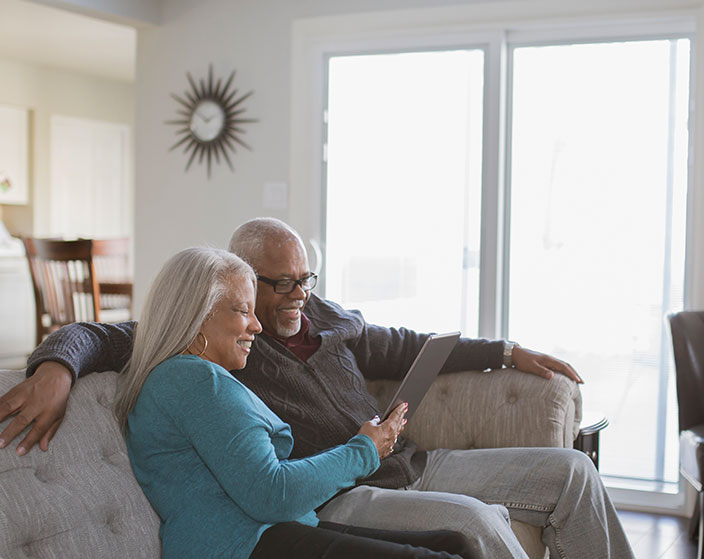 Two residents enjoying time together on a couch