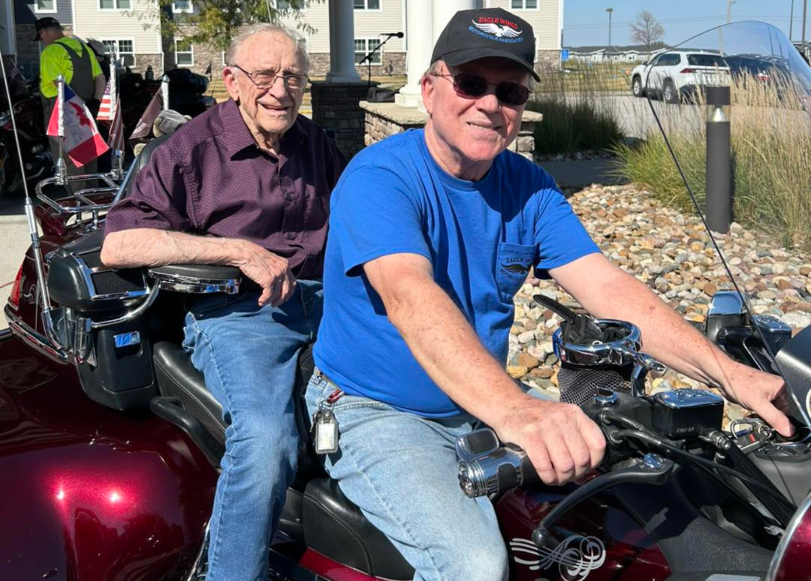 Two seniors riding together on a motorcycle trike