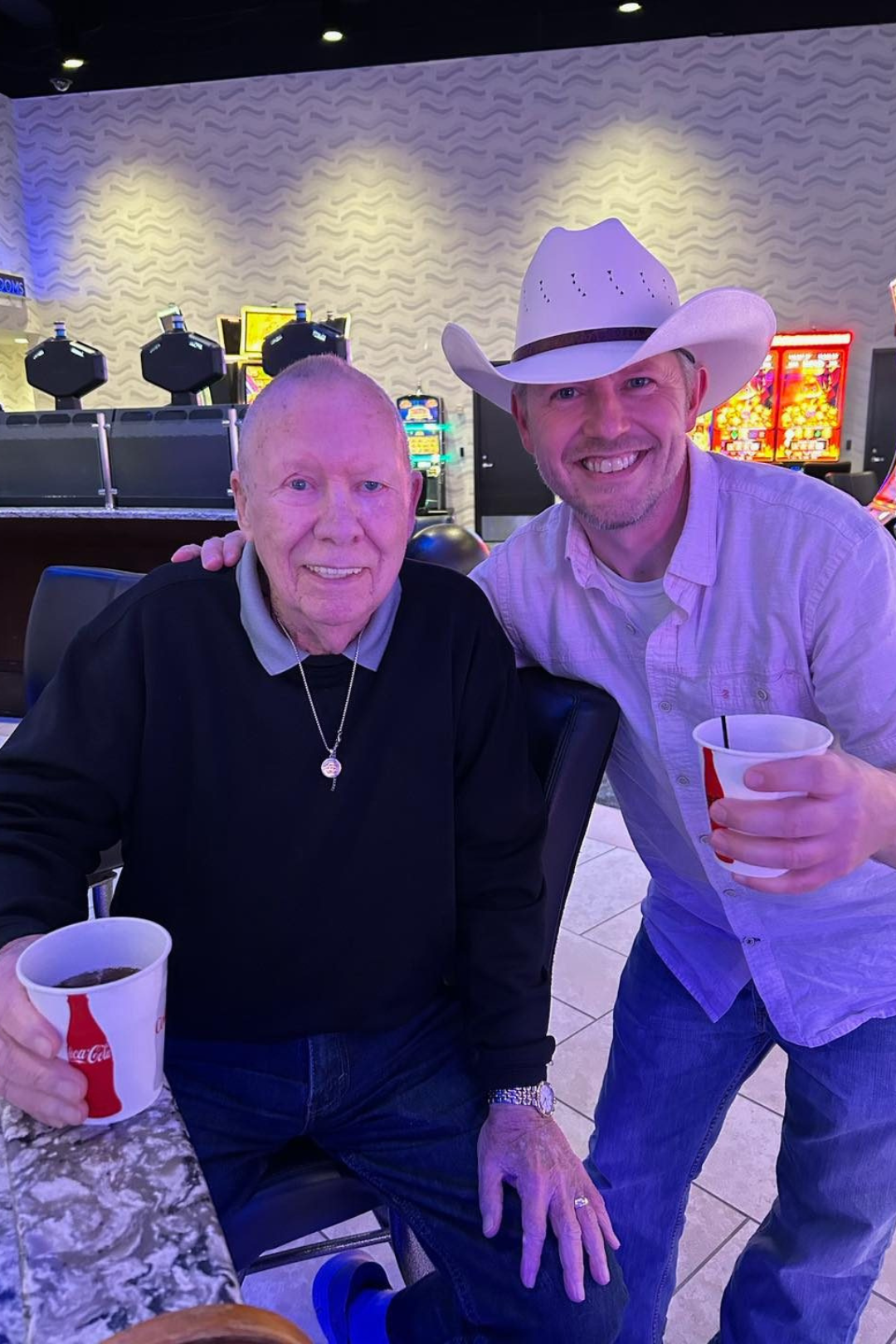 Two residents enjoying drinks at a social event