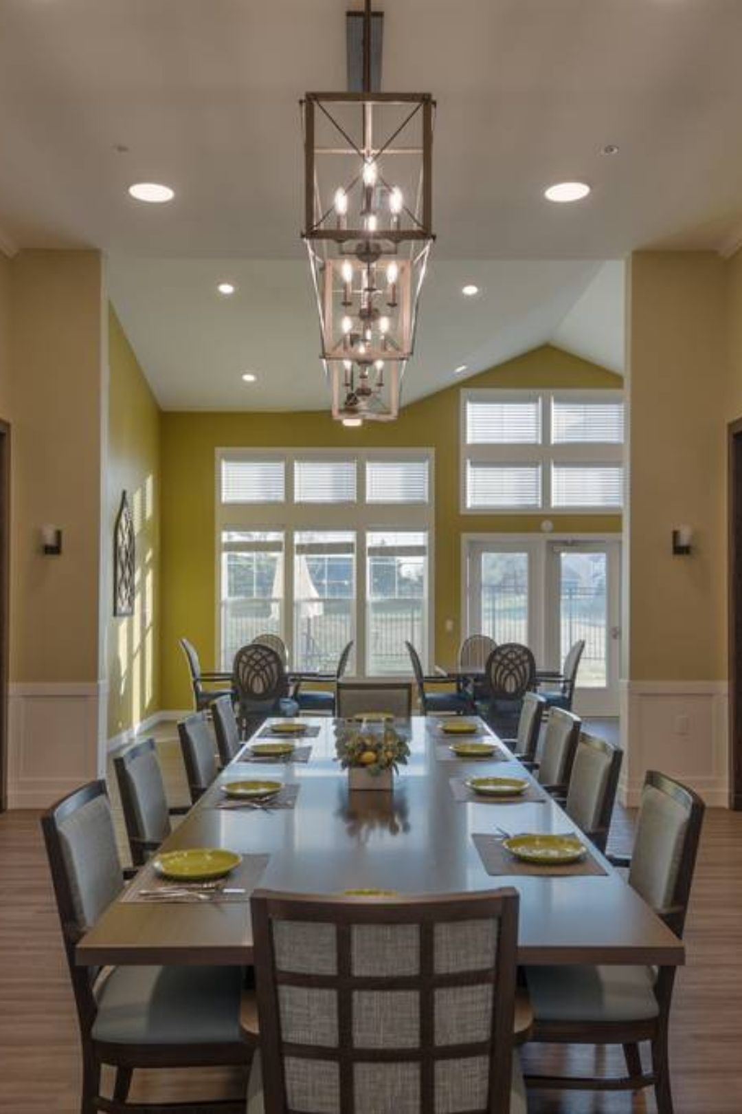 Bright dining area with large windows and tables