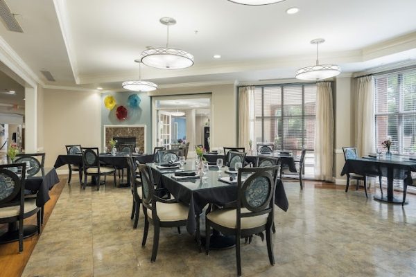 Bright dining room with tables set for a meal