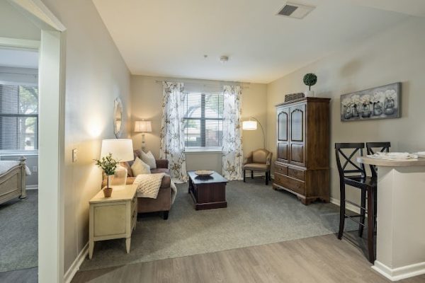 Cozy resident room with seating and natural light