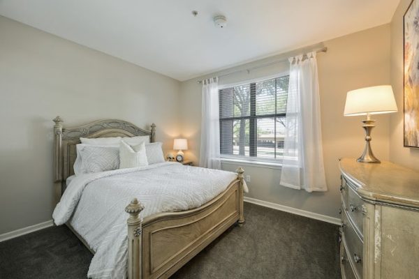 Well-furnished private resident bedroom with natural light