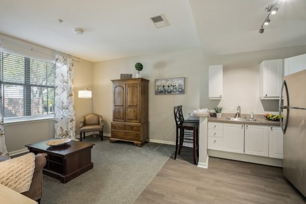 Interior view of a resident's room with kitchen area
