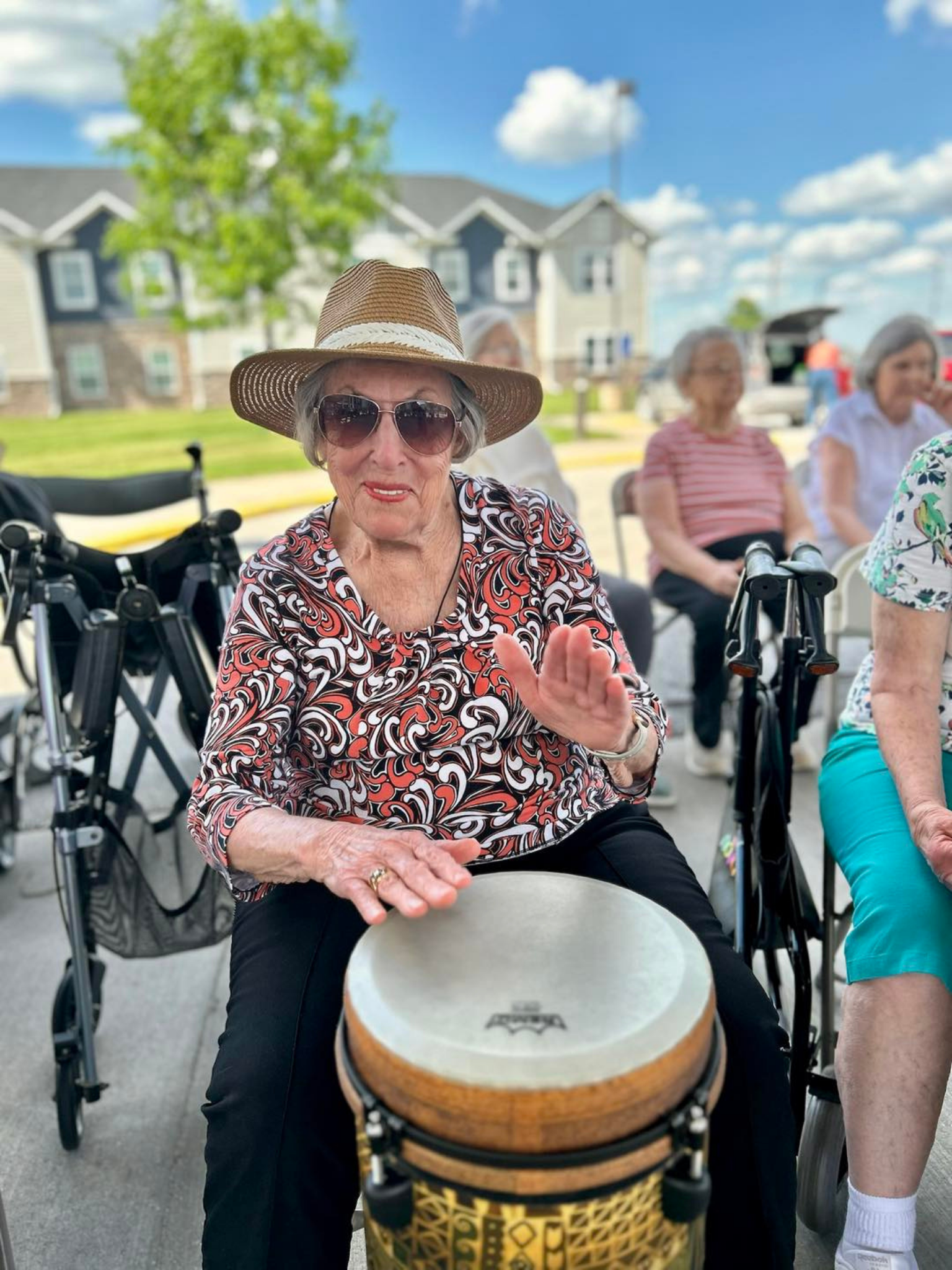Residents enjoying a musical activity outdoors