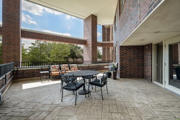 Outdoor seating area with tables and chairs