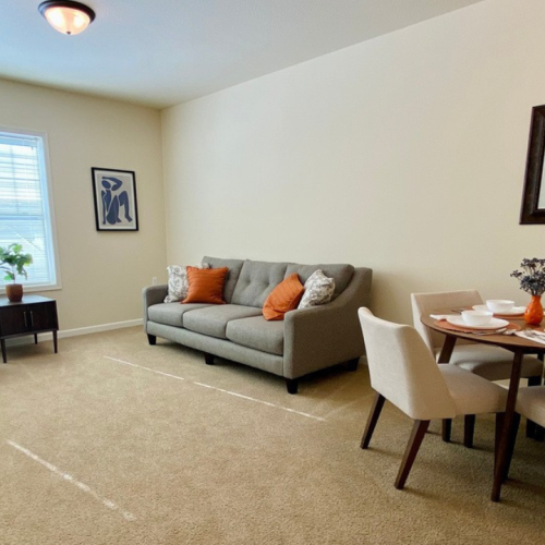 Cozy living space with a couch and dining area