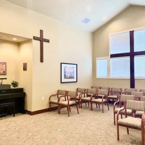 Quiet interior room with seating and a piano