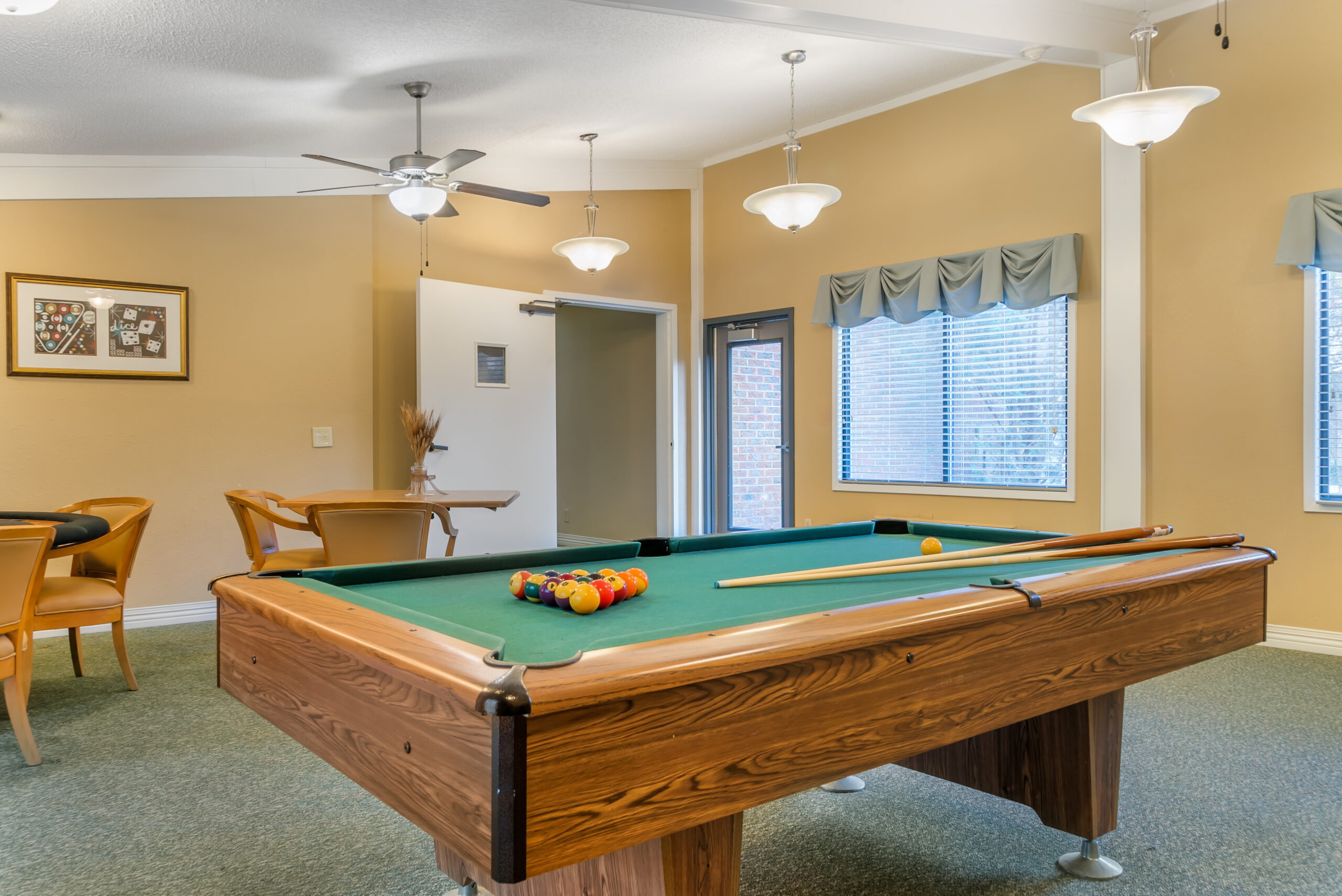 Interior view of a recreational room with a pool table