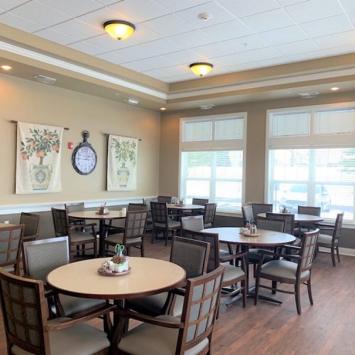 A bright and welcoming dining area with tables and chairs