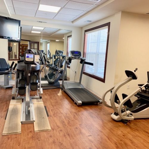 Interior view of a gym area with exercise equipment