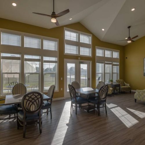 Interior view of a bright common area with seating