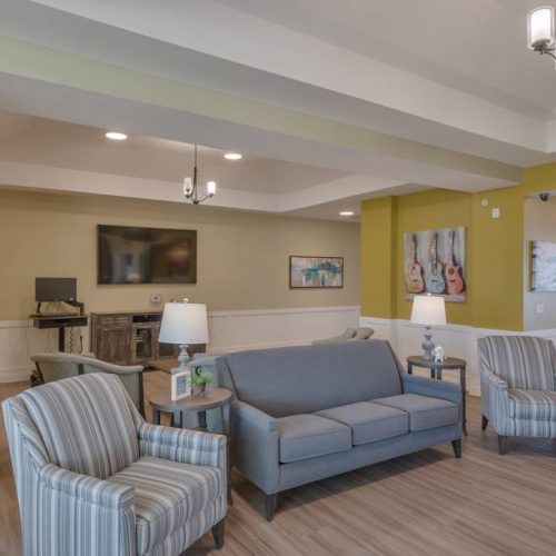 Bright common area with comfortable seating and decor