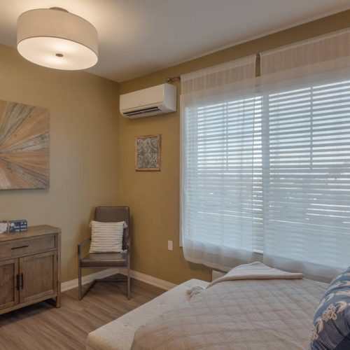 Cozy resident room with a single bed and natural light