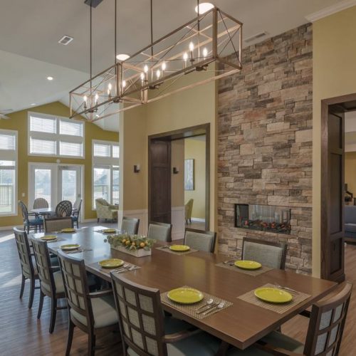 Dining room with a large wooden table and modern decor