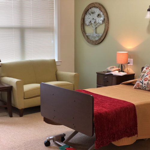 Cozy private room with a bed and seating area