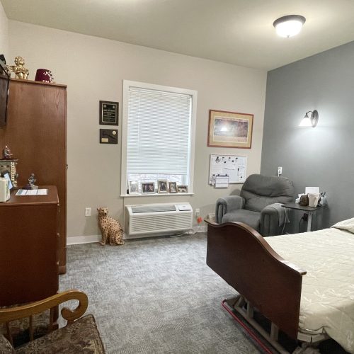 Cozy resident room with furniture and personal items