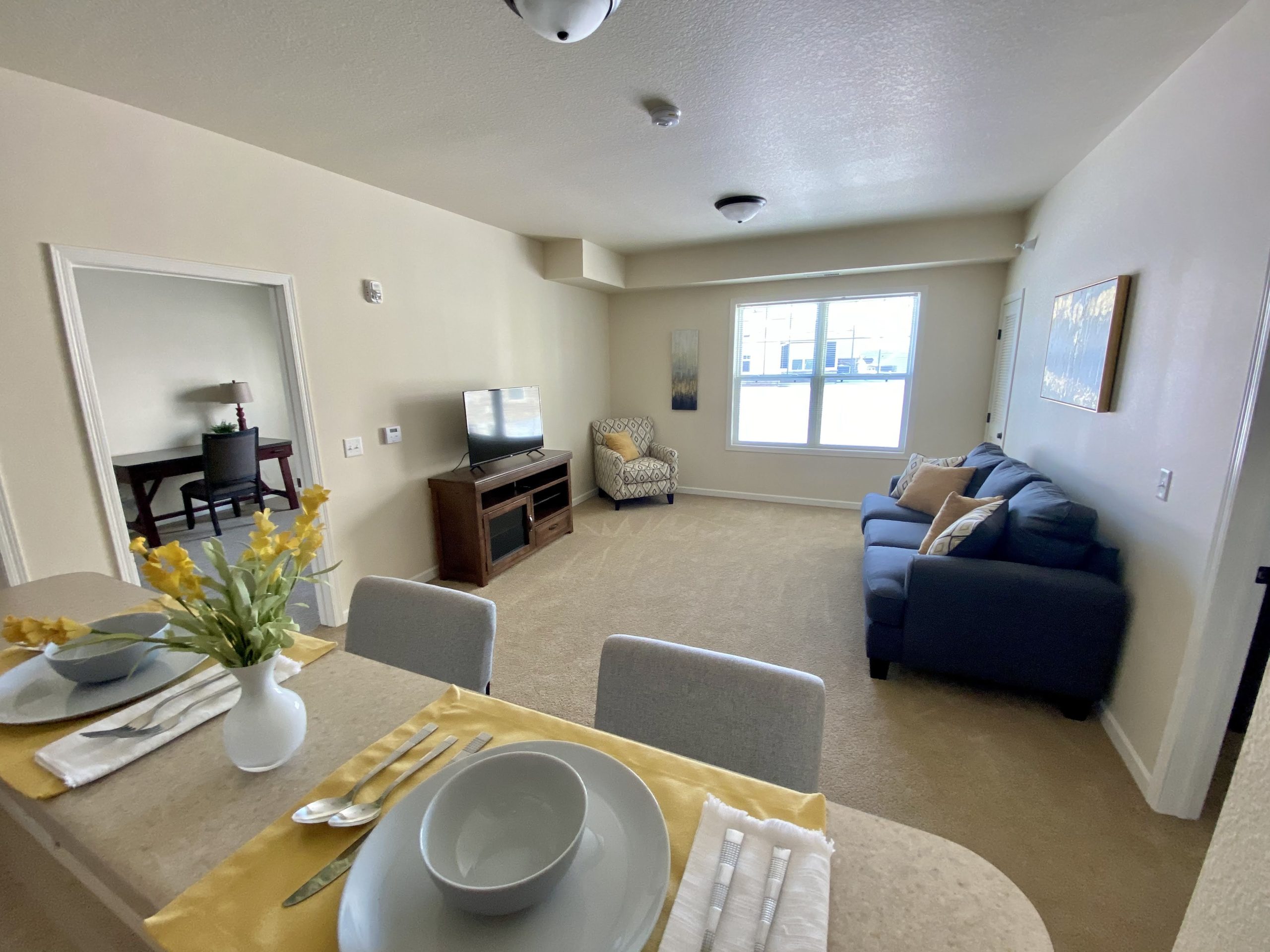 Cozy living area of a resident room with furniture