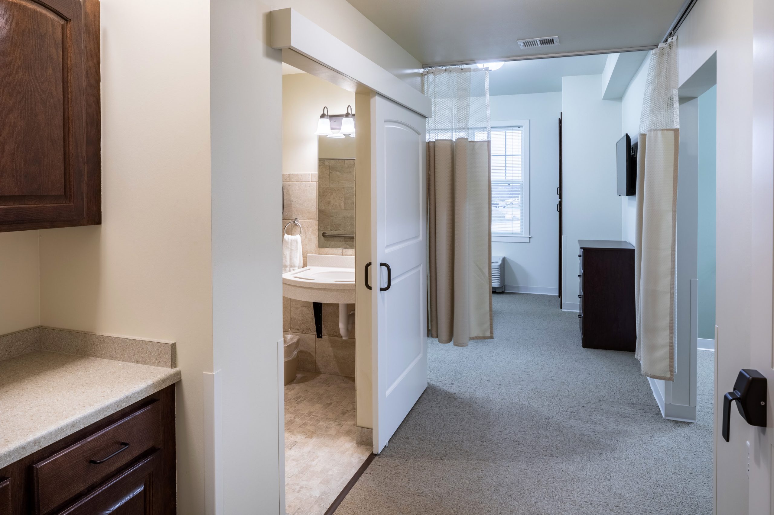 Interior view of a resident room with a bathroom